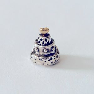 Pandora authentic wedding cake charm
￼￼sterling silver w/14K gold heart topper